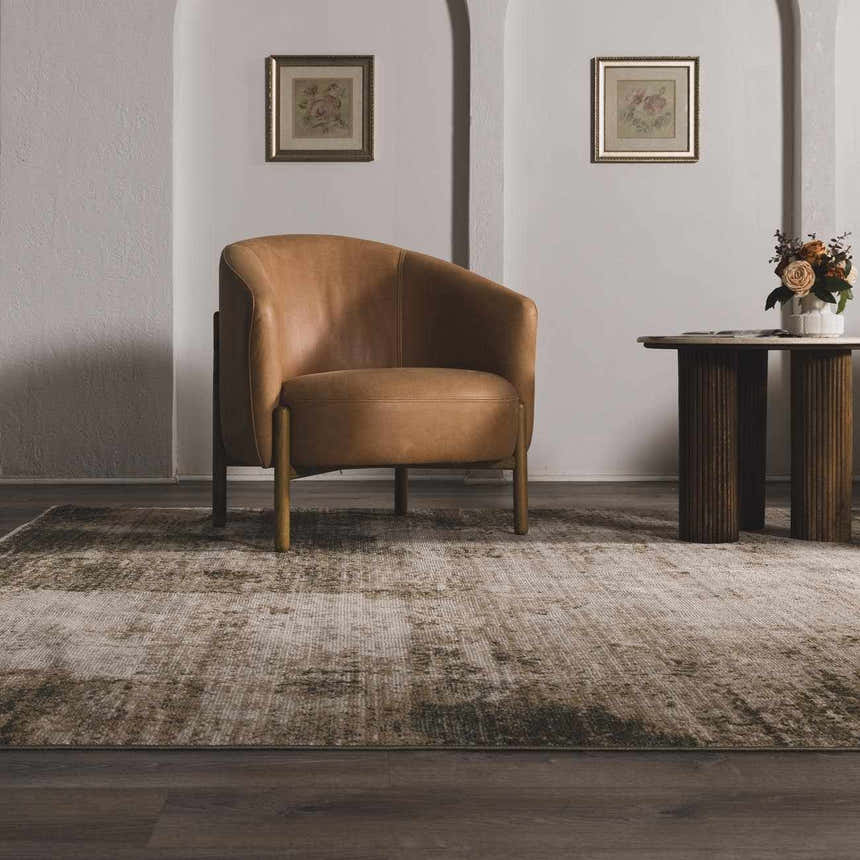 Living room scene with Galey Alix x Livabliss Abstract Modern Marble Cream Myrtle Avenue III Area Rug. Brown chair, wood table. Roomscene-Rectangle