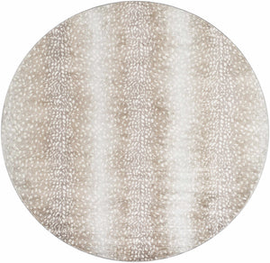 Close-up of a round Pointblank Tan Leopard Print Rug. The rug has a tan and ivory animal print pattern. Design-Round-67