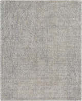 Close-up of the Pantubig Area Rug. Hand-loomed rug in charcoal, gray, ivory, and light beige with a subtle textured pattern. Design-Rectangle-810