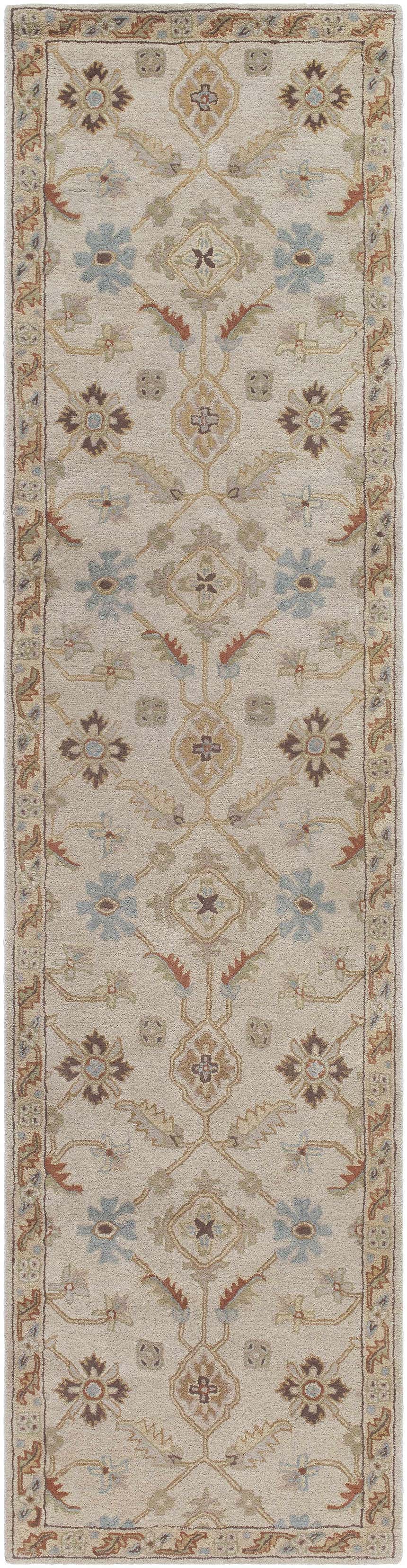 Detailed view of the Postelle Wool Rug featuring a traditional floral pattern in brown, blue, and tan hues. Design-Runner-2710