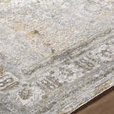 Close-up of the Pryce Sage Thick Luxe Area Rug. Farmhouse style rug with charcoal, cream, and light brown tones. Traditional pattern. Texture