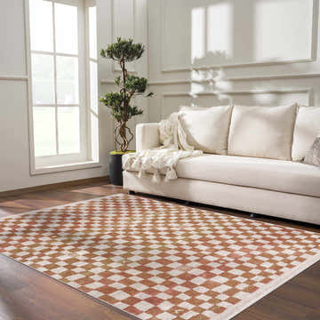 Living room scene with cream sofa and Benjy Irregular Checkboard Rug in cream and salmon. Roomscene-Rectangle
