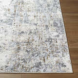 Close-up of the Avital Neutral Abstract Area Rug, showing charcoal, gray, light brown, and white tones. Front