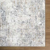 Close-up of the Avital Neutral Abstract Area Rug, showcasing its charcoal, gray, and white abstract design and texture. Corner