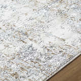 Close-up of the Avital Neutral Abstract Area Rug showing its charcoal, gray, and light brown abstract pattern. Texture