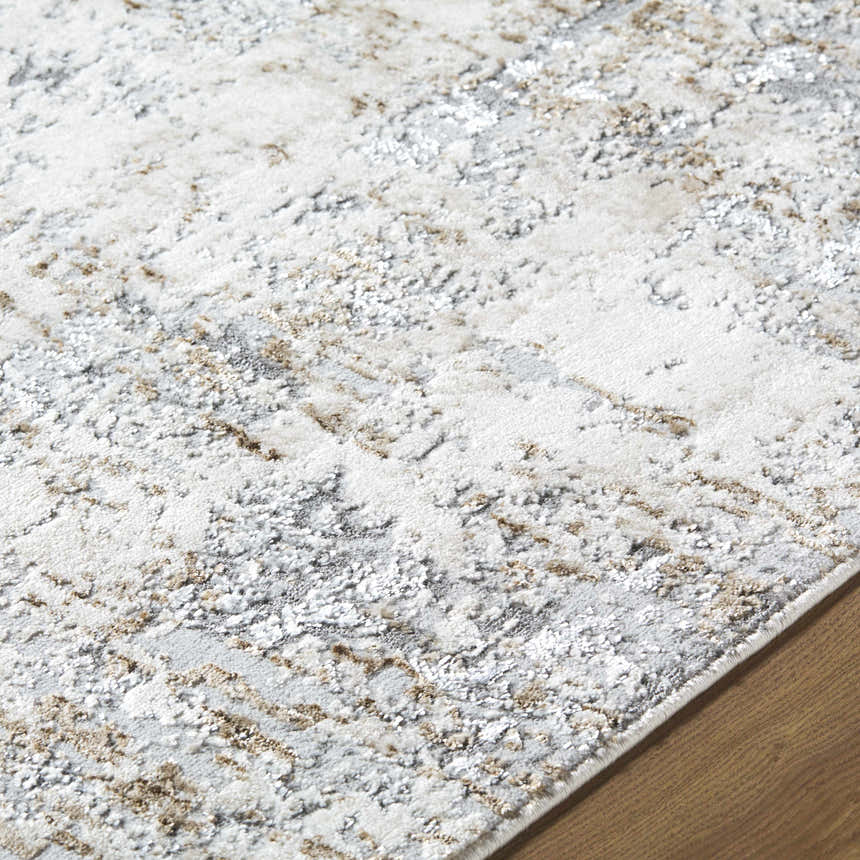 Close-up of the Avital Neutral Abstract Area Rug showing its charcoal, gray, and light brown abstract pattern. Texture