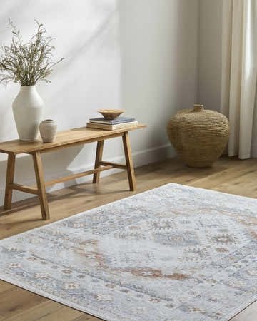 Entryway with light wood floors, bench with vases, and Agaton Blue & Brown Washable Area Rug. Roomscene-Rectangle