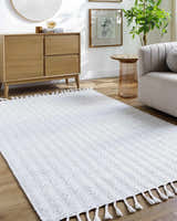 Living room scene with the Anelia Powder Blue Area Rug, wood floors, and light wood furniture. Roomscene-Rectangle