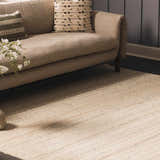 Neutral living room scene with a tan sofa and the Capote Ivory Area Rug. Roomscene-Rectangle
