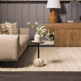 Living room scene with a Capote Ivory Area Rug, beige sofa, side table with flowers, and wood console. Roomscene-Rectangle