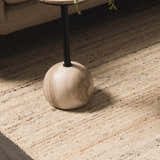 Close up of the hand tufted Capote Ivory Area Rug showing subtle charcoal, tan, and taupe colors and wool texture. Roomscene-Rectangle