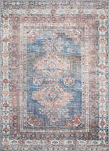 Close-up of the Baltinglass Rust & Blue Washable Area Rug, featuring a traditional oriental pattern and distressed texture. Design-Rectangle