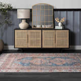 Entryway scene with a Baltinglass Rust & Blue Washable Area Rug, dark wood floors, and a cane cabinet. Roomscene-Rectangle