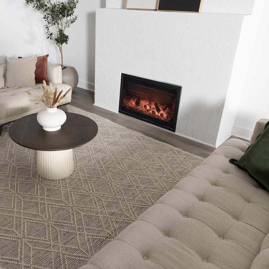 Living room scene with a Ramsbury Wool Area Rug in ivory and black geometric pattern. Roomscene-Rectangle