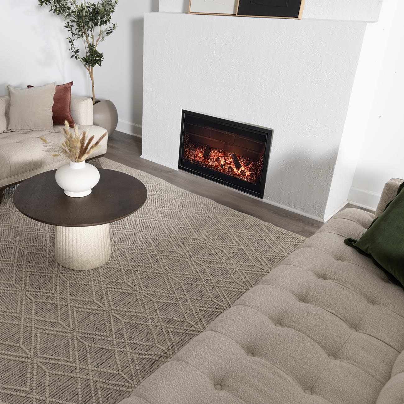 Living room scene with a Ramsbury Wool Area Rug in ivory and black geometric pattern. Roomscene-Rectangle