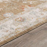 Close-up of the Rangeville Thick Luxe Statement Rug. Features brown, orange, and blue traditional patterns. Pile