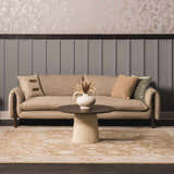 Living room scene with a neutral sofa and Rangeville Thick Luxe Statement Rug in beige, cream, and burnt orange tones. Roomscene-Rectangle