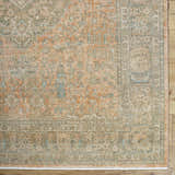 Close-up of Becki Owens x Livabliss Renaissance BORI-2301 rug. Hand-crafted wool rug in beige, denim, coral, tan, and taupe. Corner