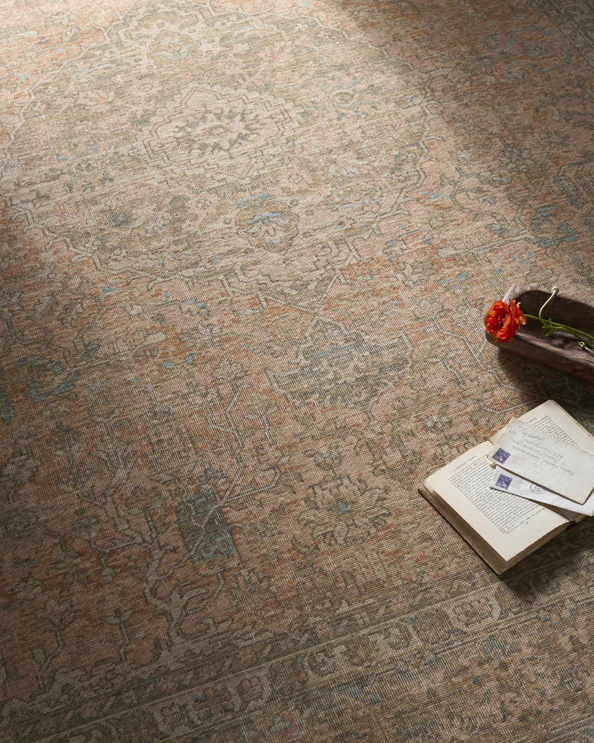 Close-up of the Becki Owens x Livabliss Renaissance BORI-2301 rug. Beige, denim, coral, and tan farmhouse style wool rug. Styleshot