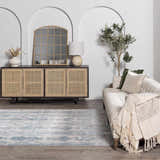 Living room scene with Rydalmere Luxury Ultra Soft Rug in light blue. Styled with sofa, cabinet, and neutral decor. Roomscene-Rectangle