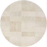 Close-up of a round Radia Luxe Rug in ash and silver gray. Farmhouse style rug with a geometric block pattern. Design-Round-7