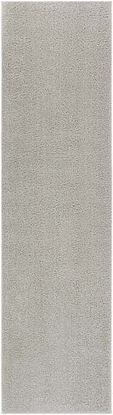 Close-up of the Judy Solid Gray Washable Shag Rug, showing its soft texture and light gray color. Design-Runner-2710