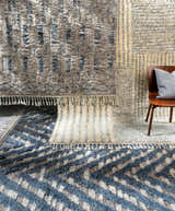 Close-up of Lambsburg Knotted Wool Rug. Features blue, beige, and charcoal colors, plus a textured, geometric design. Styleshot