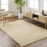 Farmhouse living room with beige Mihal Area Rug, jute texture, wood chair, and console table. Roomscene-Rectangle