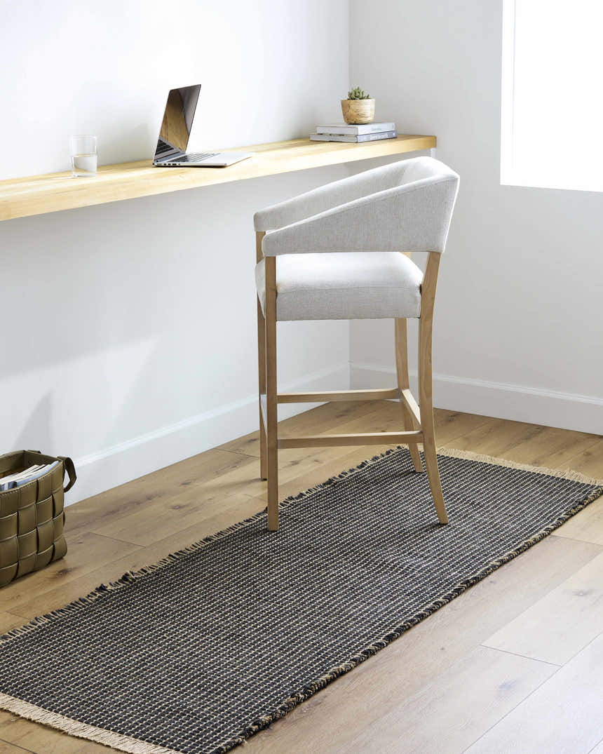 Minimalist office scene with Kimi Machine Woven Becki Owens x LIVABLISS rug in black and light brown. Roomscene-Runner