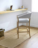 Light brown Kimi Machine Woven runner rug in a bright, minimalist office space with a light wood desk and chair. Roomscene-Runner
