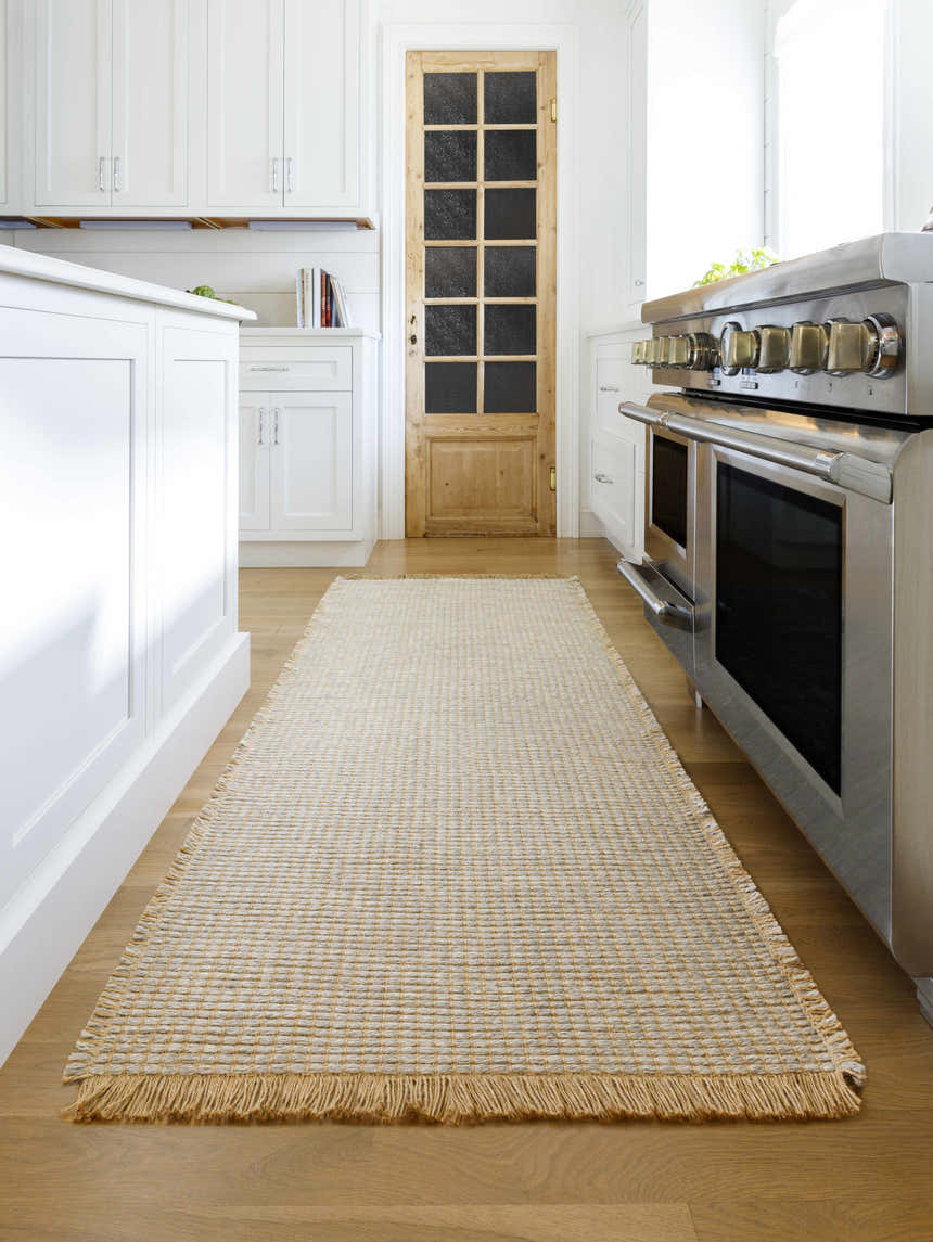 Farmhouse kitchen with white cabinets and Kimi Becki Owens x LIVABLISS runner rug in gray and light brown. Roomscene-Runner