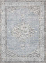 Close-up of Lila Medallion Denim Area Rug. Features a traditional medallion pattern in charcoal, gray, and denim blue hues. Design-Rectangle