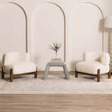 Living room scene with two cream chairs on a Lila Medallion Denim Area Rug with a gray table between them. Roomscene-Rectangle