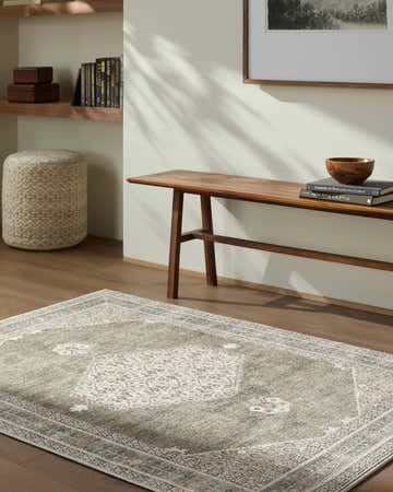 Entryway scene with a Lila Medallion Green Area Rug, wood bench, books, and ottoman. Farmhouse style. Roomscene-Rectangle