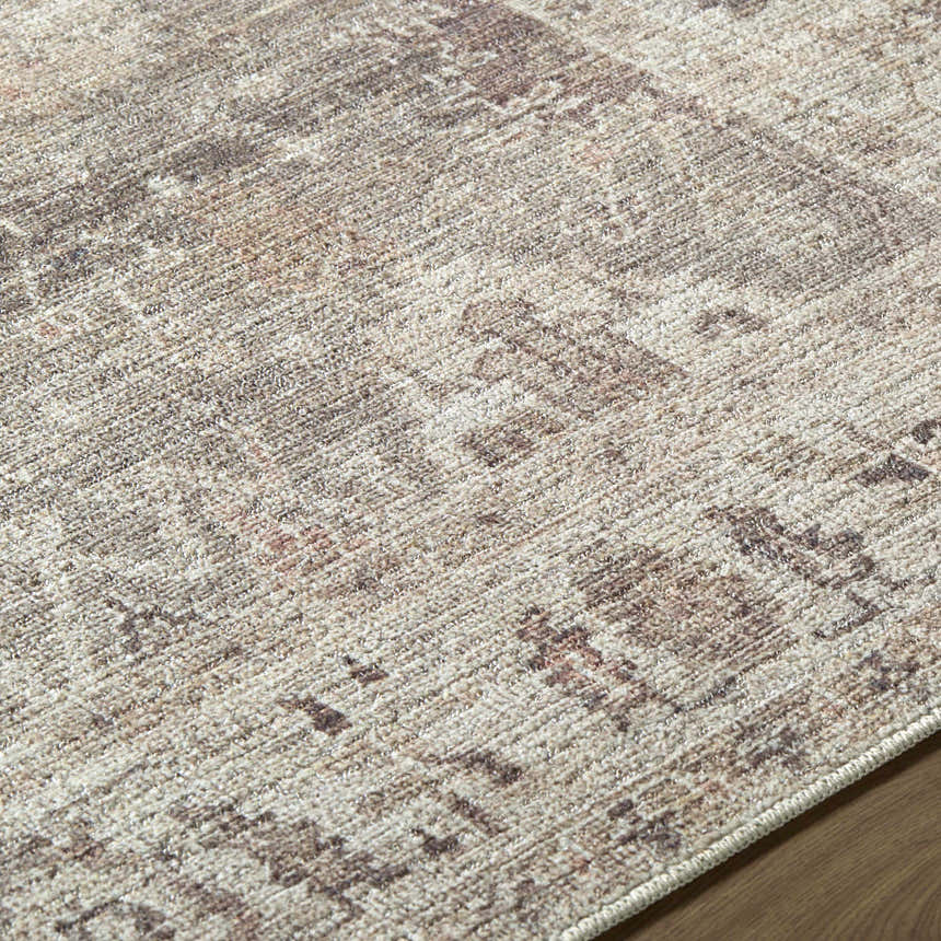 Close-up of the Matat Area Rug. Beige, chestnut, and ivory tones create a traditional, textured pattern. Texture