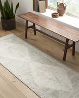 Hallway scene with a Luca Medallion Olive Area Rug, wooden bench, potted plant, and natural light from a window. Roomscene-Runner