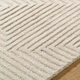 Close up of the Citro Ivory Area Rug showing its hand tufted wool texture and contemporary geometric design. Texture