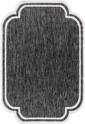 Close-up of Arnola Black Outdoor Rug featuring a black and cream color palette and farmhouse style. Design-Rectangle-537