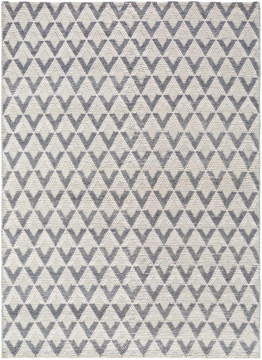 Close-up of the Maik Area Rug. Hand-woven rug with a geometric diamond pattern in dark gray, light gray, and nutmeg. Design-Rectangle-810