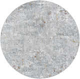 Close-up of the round Ifama Textured Rug in light gray, medium gray, light brown, and dark brown. Design-Round-67