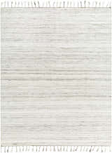 Close-up of the Anaya Cream Area Rug. Hand woven, with beige, bone, and gray hues and tasseled edges. Farmhouse style. Design-Rectangle-810