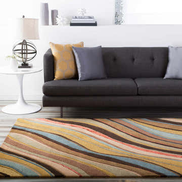 Living room scene with a Seminole Area Rug in beige, brown, and teal, styled with a gray sofa and modern decor. Roomscene-Rectangle