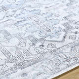 Close-up of Nadia Silver Gray Area Rug showing its light purple, silver gray, and medium gray traditional pattern. Texture