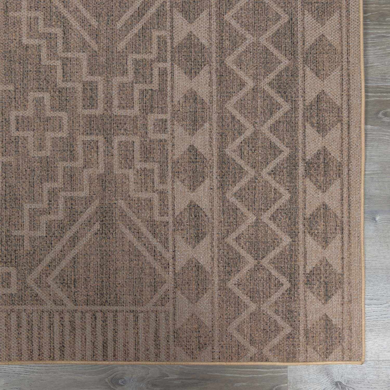 Close up of the Halle Beige Washable Area Rug showing the geometric pattern and texture. Brown and gray tones. Swatch