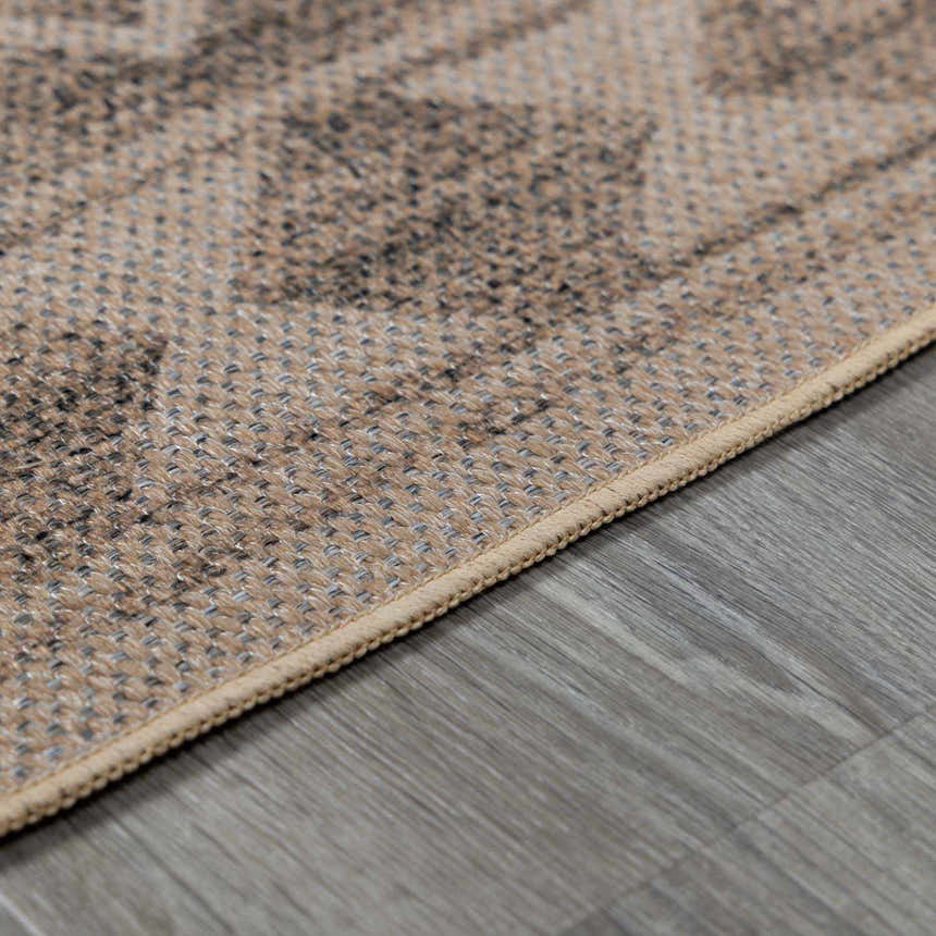 Close-up of the beige and brown patterned Halle Beige Washable Area Rug showing woven texture and neutral tones. Pile