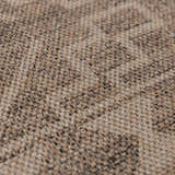 Close-up of the Halle Beige Washable Area Rug showing its woven texture and blend of beige, brown, and gray tones. Texture