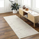 Entryway with a beige Keats Area Rug runner, wood floors, and a light wood console table. Roomscene-Runner