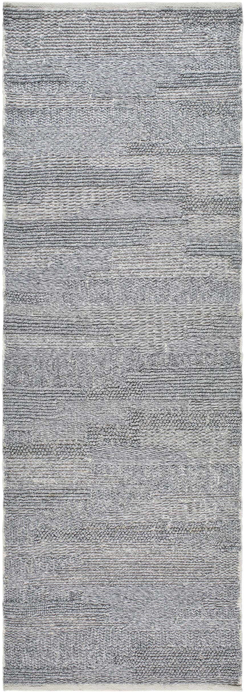 Close-up of the hand woven Chepe Area Rug. Charcoal, gray, and silverton hues create a contemporary, textured stripe pattern. Design-Runner-268