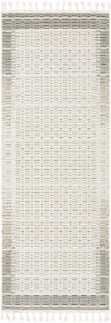 Close-up of the Ajda Area Rug, a machine-woven rug with a geometric pattern in beige, bone, and gray tones with tassels. Design-Runner-2773