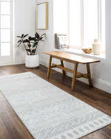 Entryway with a Danon Washable Area Rug in arctic stone. Farmhouse style with wood bench, plant, and bright natural light. Roomscene-Runner